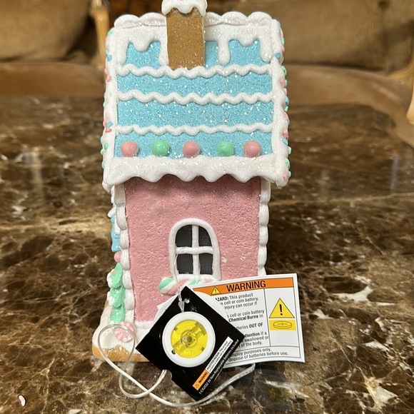 A Christmas gingerbread house that lights up. - Picture 2 of 4